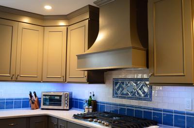 Showplace cabinets and wooden curved hood